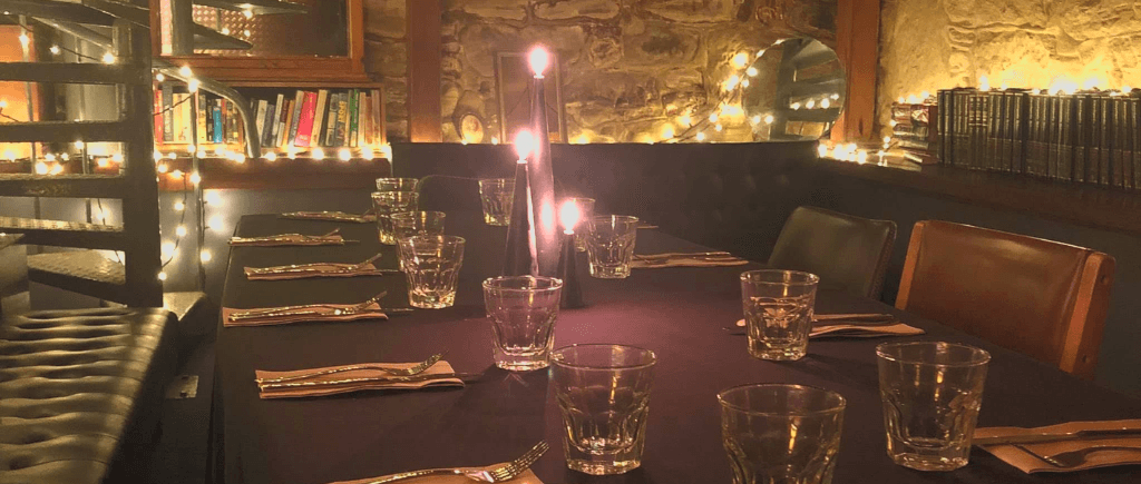 Atmospheric candlelit dinner table